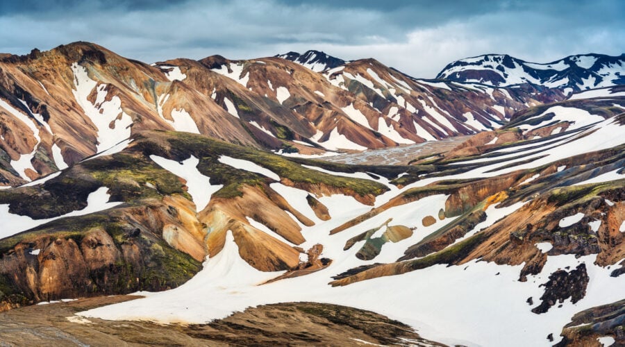 Volcanic mountain with snow covered on Blahnjukur trail in Icela